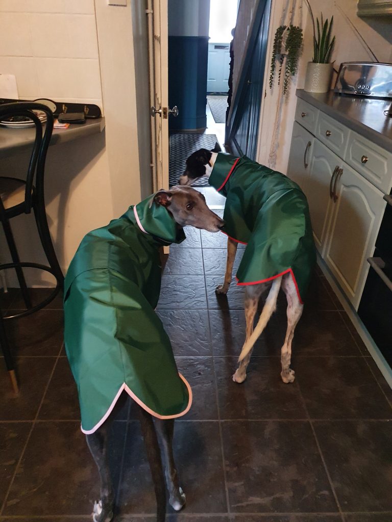 Peggy Gerry in green shower macs together 1